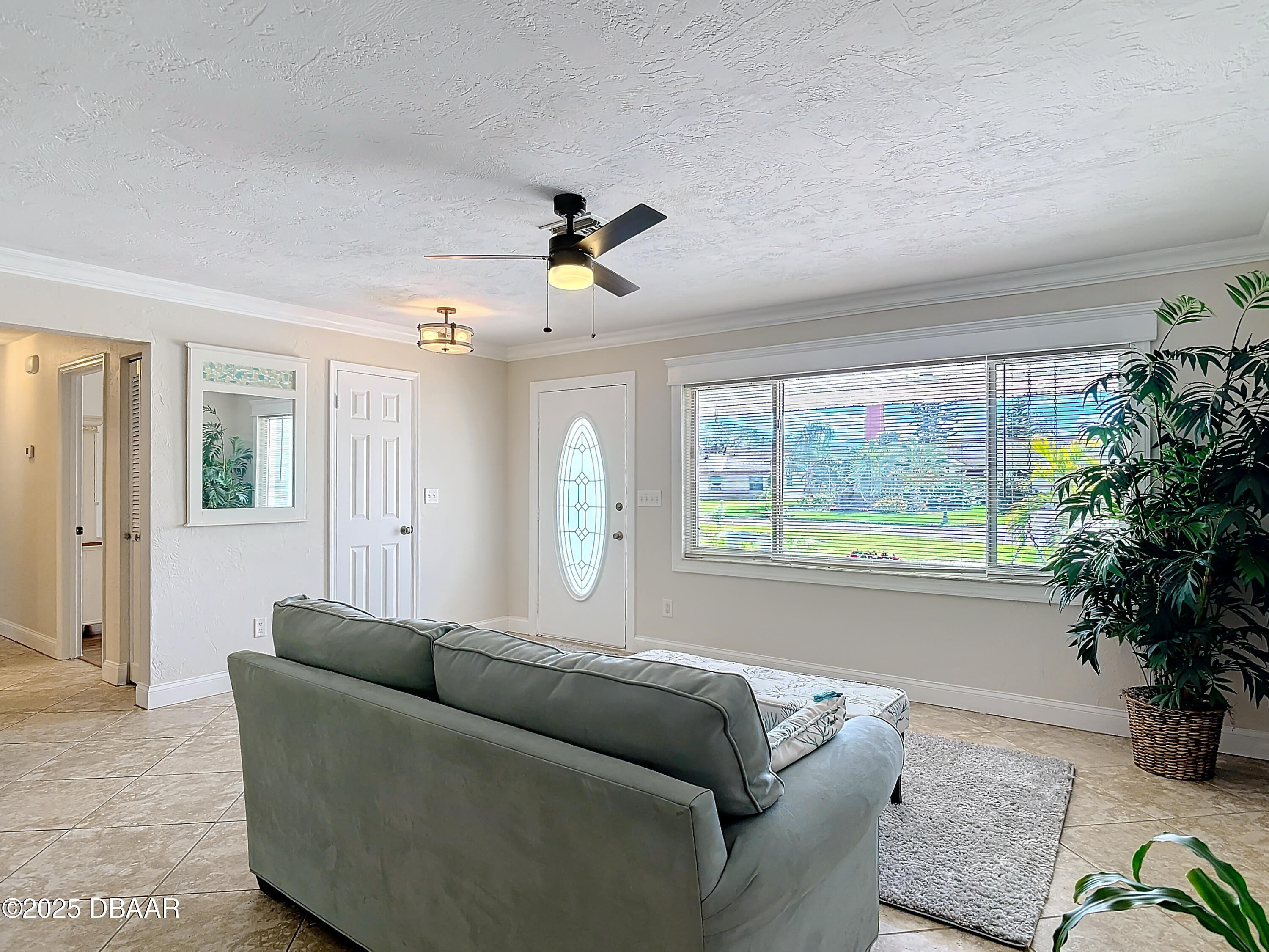 86 Rains Court Ponce Inlet, FL 32127 - Photo 10 of 71 a living room with furniture and a large window