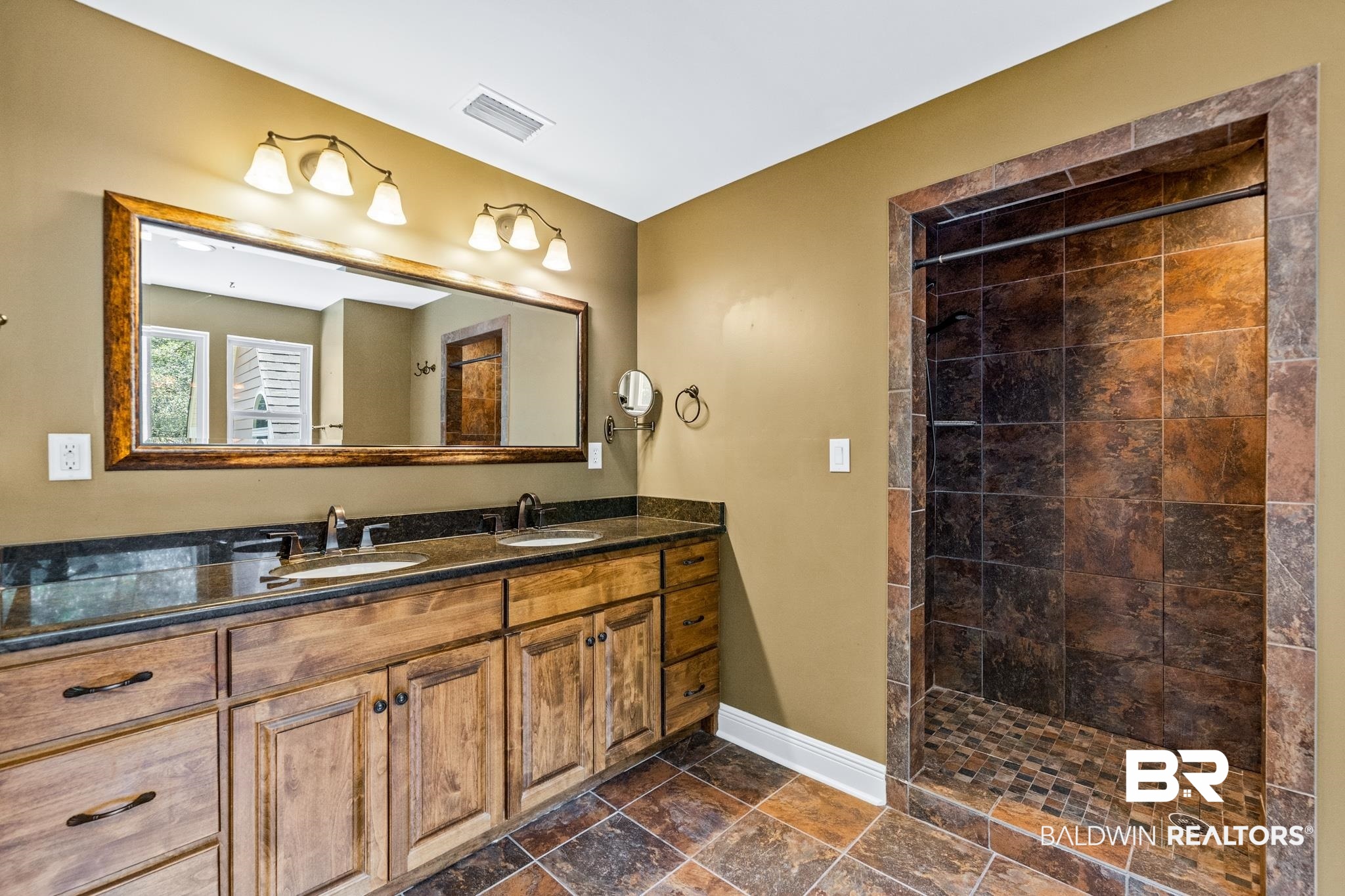8321 Dixon Road Bay Minette, AL 36507 - Photo 50 of 79 Bathroom featuring tiled shower, tile patterned floors, and dual vanity
