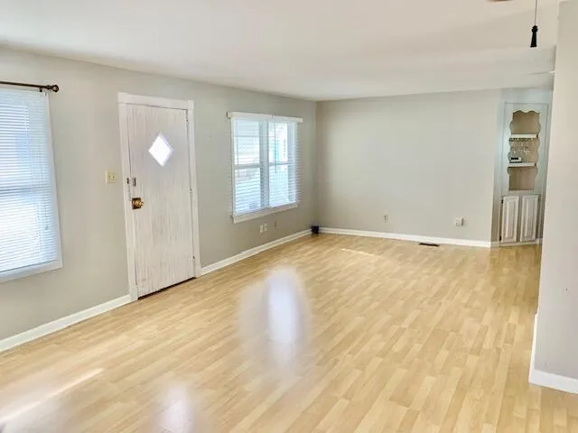 a view of an empty room and window