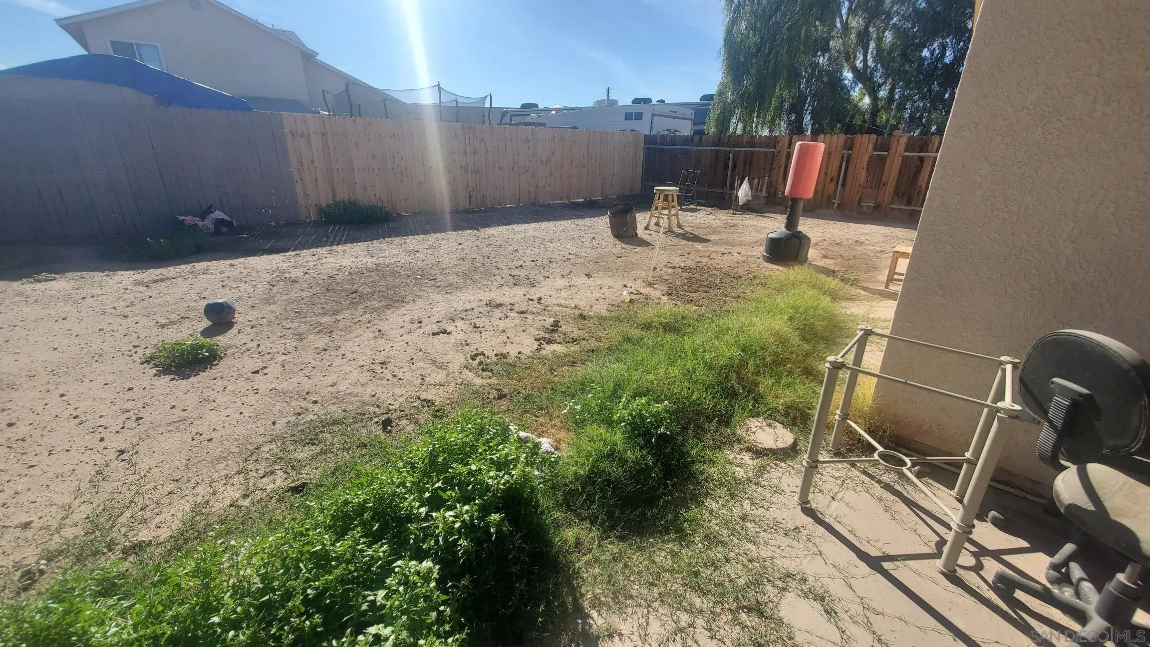 312 Chisolm Trail Imperial, CA 92251 - Photo 7 of 10 a backyard of a house with table and chairs