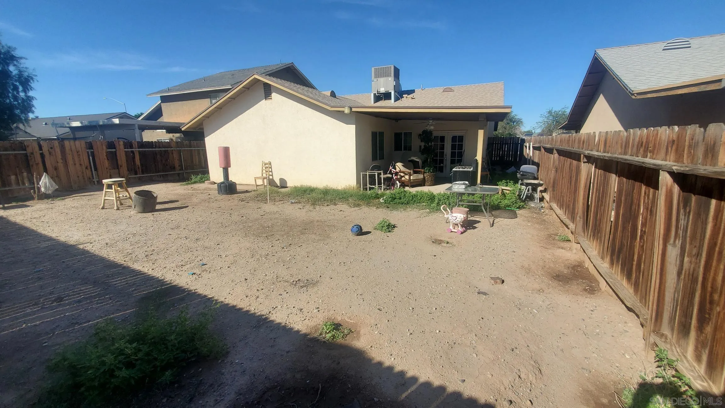 312 Chisolm Trail Imperial, CA 92251 - Photo 8 of 10 a view of a house with wooden fence