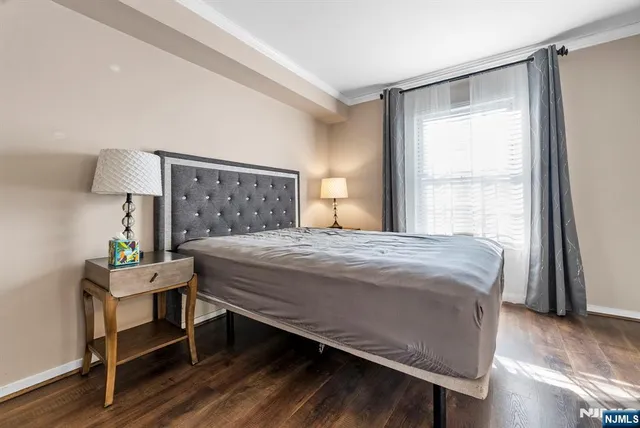 a living room with furniture and a hard wood floor