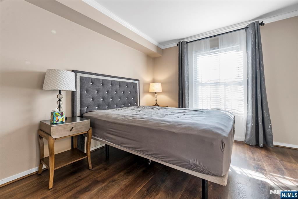 753 Summer, Unit 3D Newark, NJ 07104 - Photo 18 of 41 a bedroom with a bed and a window