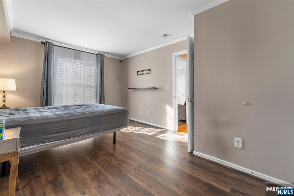 753 Summer, Unit 3D Newark, NJ 07104 - Photo 20 of 41 a bedroom with a bed and a window