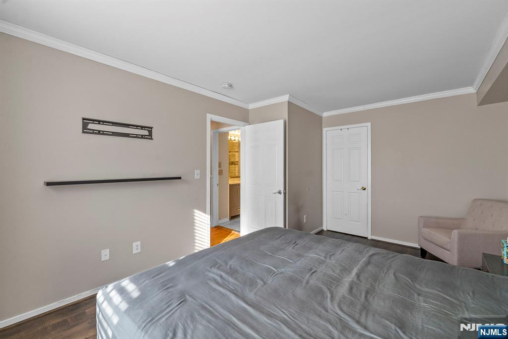 753 Summer, Unit 3D Newark, NJ 07104 - Photo 21 of 41 a view of a room with wooden floor and white walls