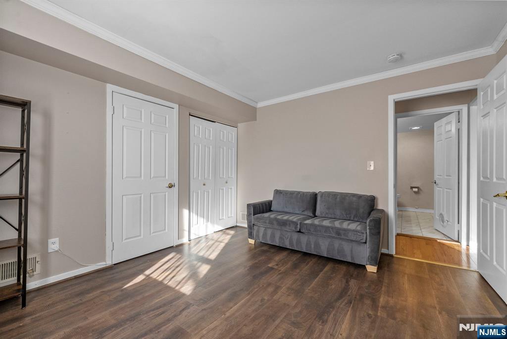 753 Summer, Unit 3D Newark, NJ 07104 - Photo 23 of 41 a living room with furniture and a wooden floor