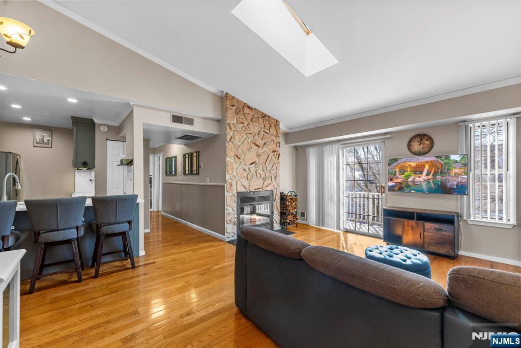 753 Summer, Unit 3D Newark, NJ 07104 - Photo 3 of 41 a living room with furniture and a flat screen tv