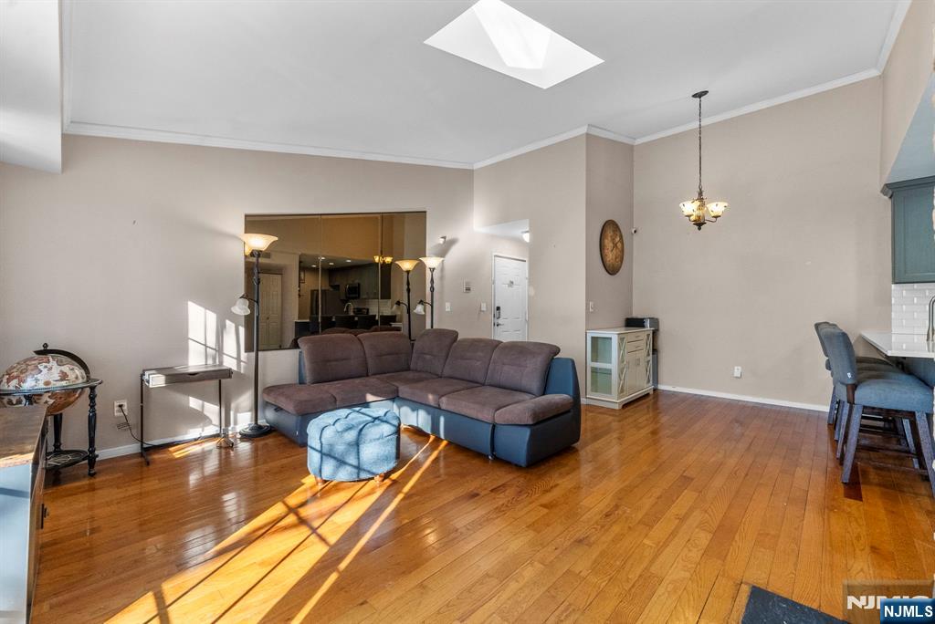 753 Summer, Unit 3D Newark, NJ 07104 - Photo 4 of 41 a living room with furniture and wooden floor