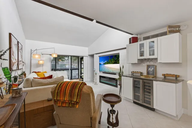 a kitchen with stainless steel appliances kitchen island granite countertop a refrigerator and a stove top oven