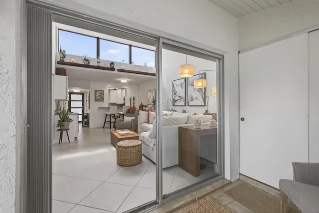 a view of a living room and a livingroom with furniture