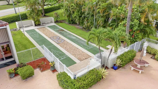 a view of a backyard with sitting area