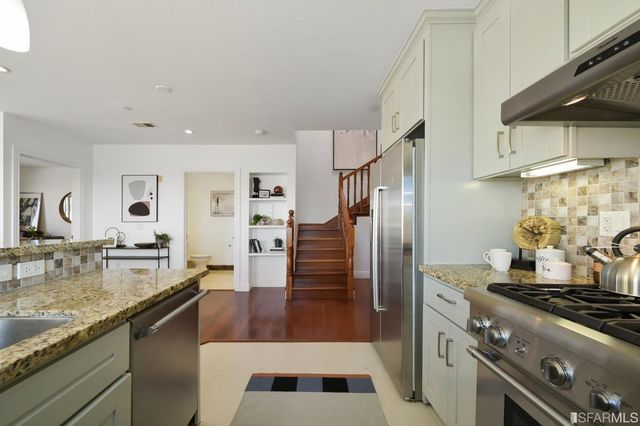 a view of a workspace room with furniture and wooden floor