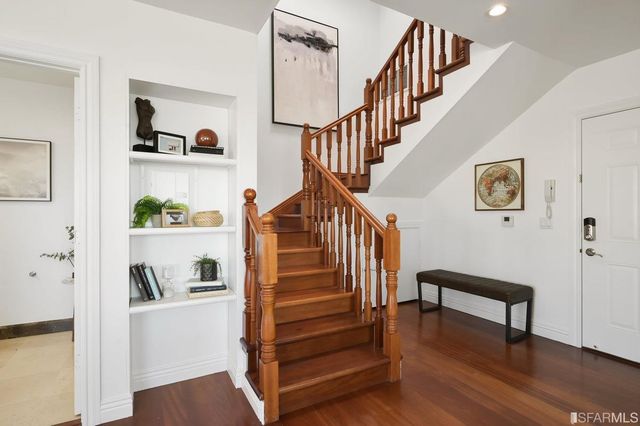 a view of a hallway with washer and dryer