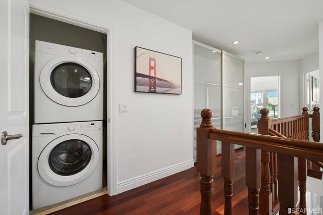 a bedroom with a large bed couch and a window