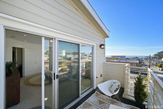 a view of a lake with outdoor seating