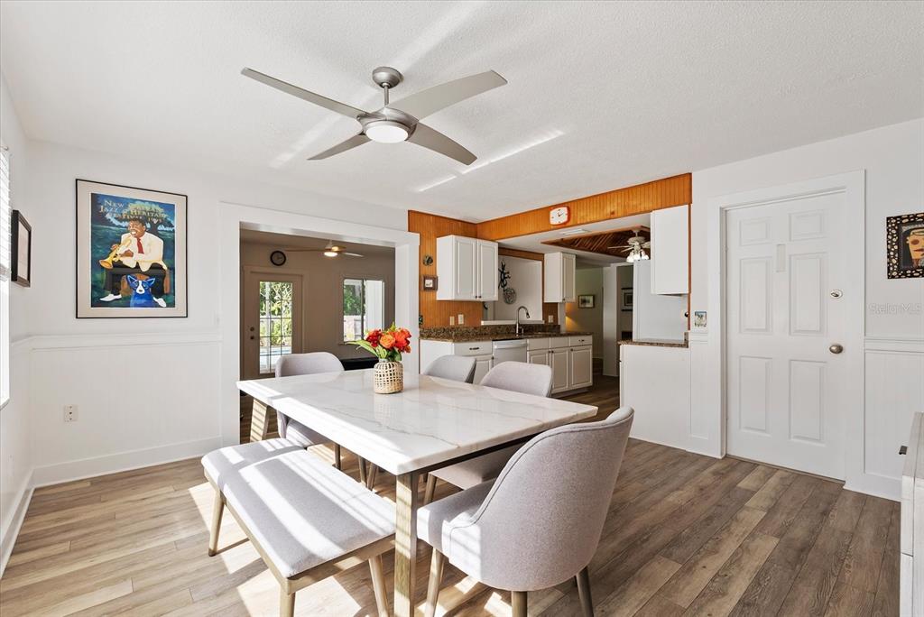 1700 Patricia Avenue Dunedin, FL 34698 - Photo 11 of 31 a view of a dining room with furniture and a chandelier