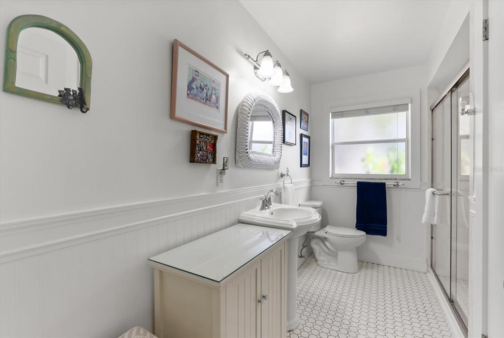 1700 Patricia Avenue Dunedin, FL 34698 - Photo 14 of 31 a bathroom with a sink and a mirror