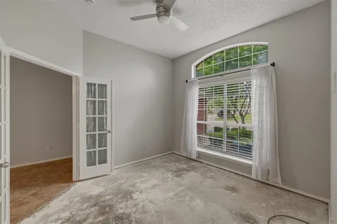 an empty room with windows