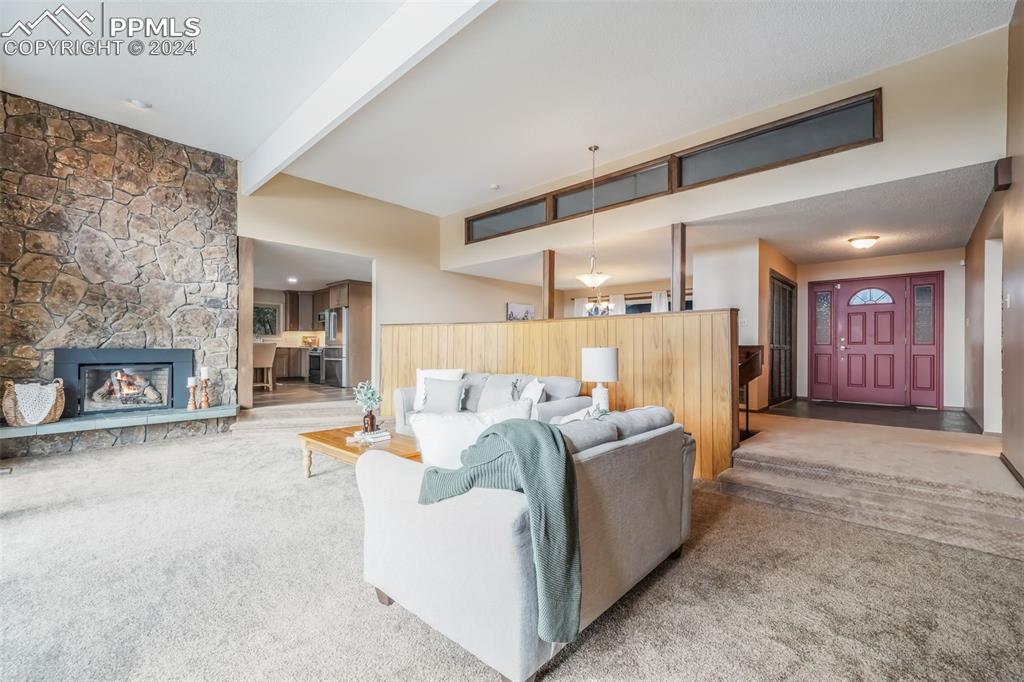 18585 Augusta Drive Monument, CO 80132 - Photo 17 of 50 a living room with furniture and a fireplace