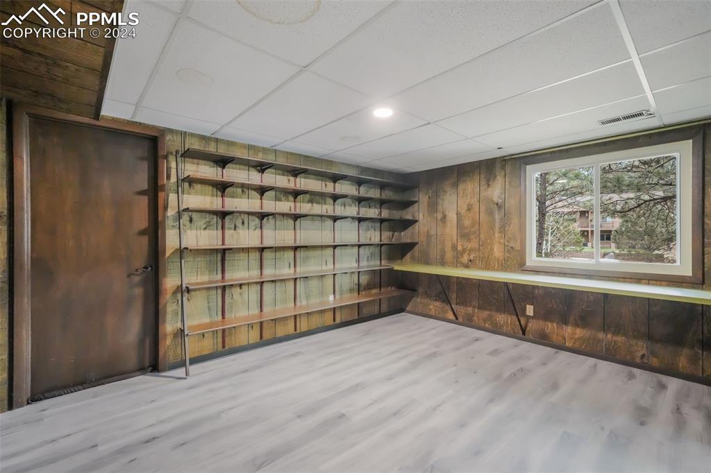 18585 Augusta Drive Monument, CO 80132 - Photo 26 of 50 a view of an empty room with wooden floor and a window