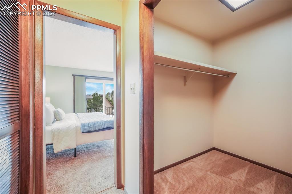 18585 Augusta Drive Monument, CO 80132 - Photo 36 of 50 a view of a room that has a bed and glass door