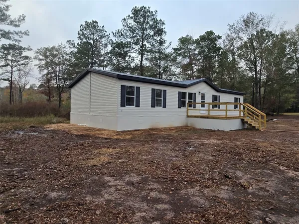 a view of a road with a yard