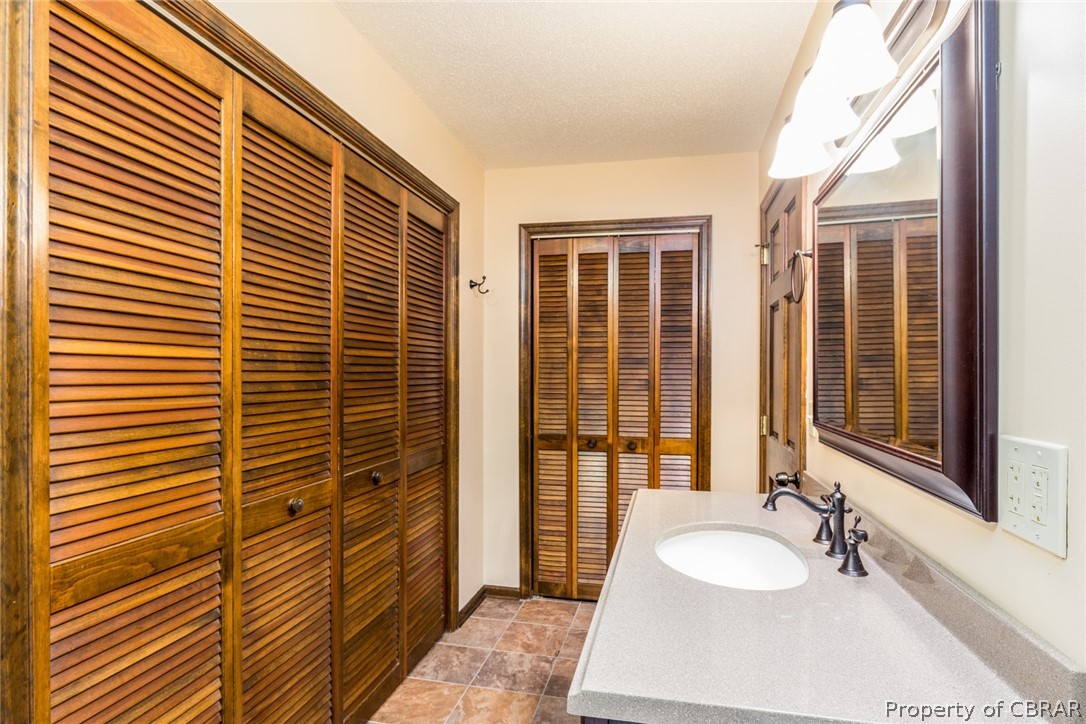 10060 Figg Shop Road Gloucester, VA 23061 - Photo 23 of 38 Two closets in the owner's bath.