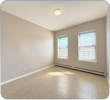 a kitchen with cabinets and window