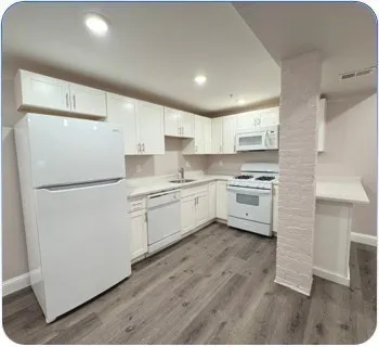 a view of kitchen with wooden floor