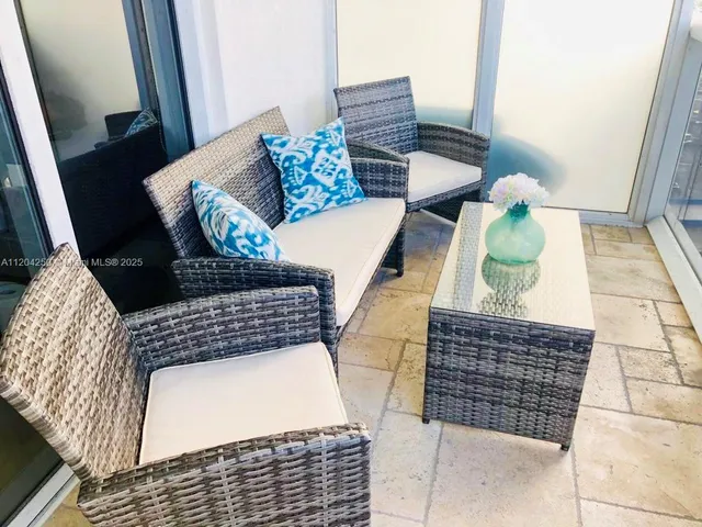 a view of a entryway door with wooden floor