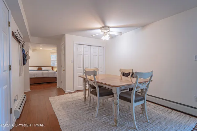 a living room with furniture a rug and a fireplace