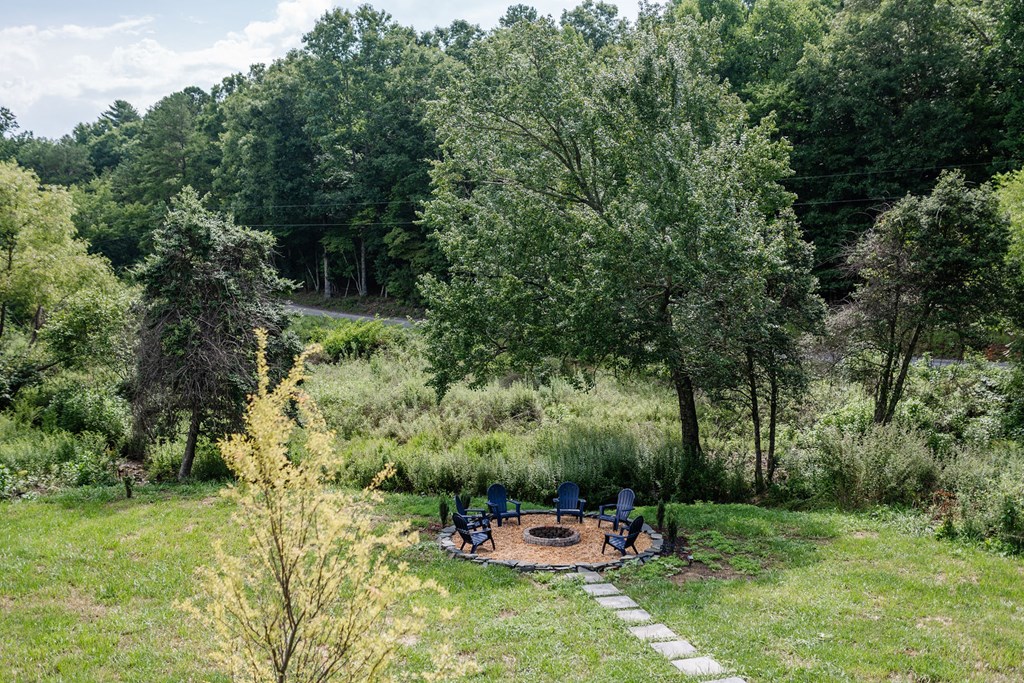 89 High Mdws Drive Morganton, GA 30560 - Photo 11 of 63 a backyard of a house with a yard and outdoor seating