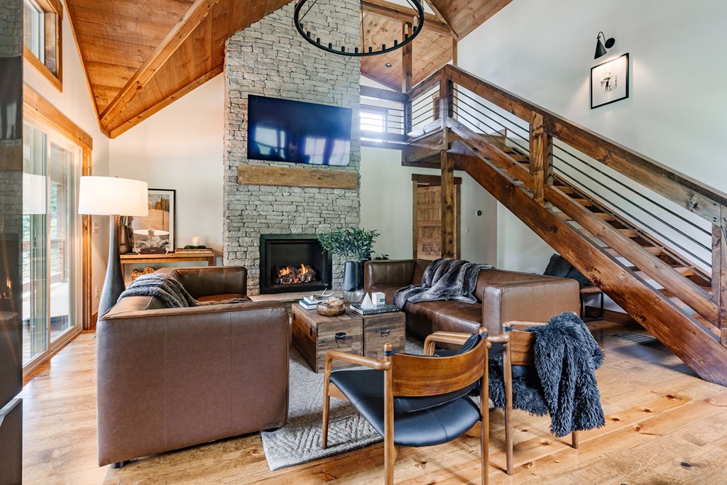 89 High Mdws Drive Morganton, GA 30560 - Photo 14 of 63 a living room with furniture a fireplace and a flat screen tv