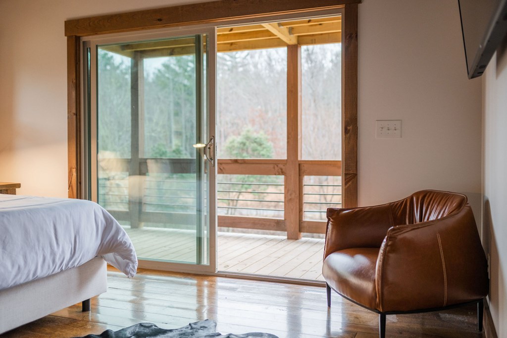 89 High Mdws Drive Morganton, GA 30560 - Photo 41 of 63 a living room with furniture and a floor to ceiling window