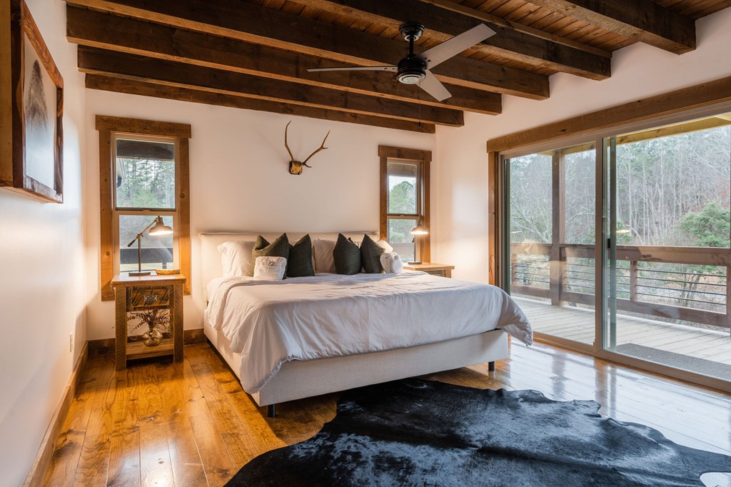 89 High Mdws Drive Morganton, GA 30560 - Photo 44 of 63 a bedroom with a bed and a large window with outer view