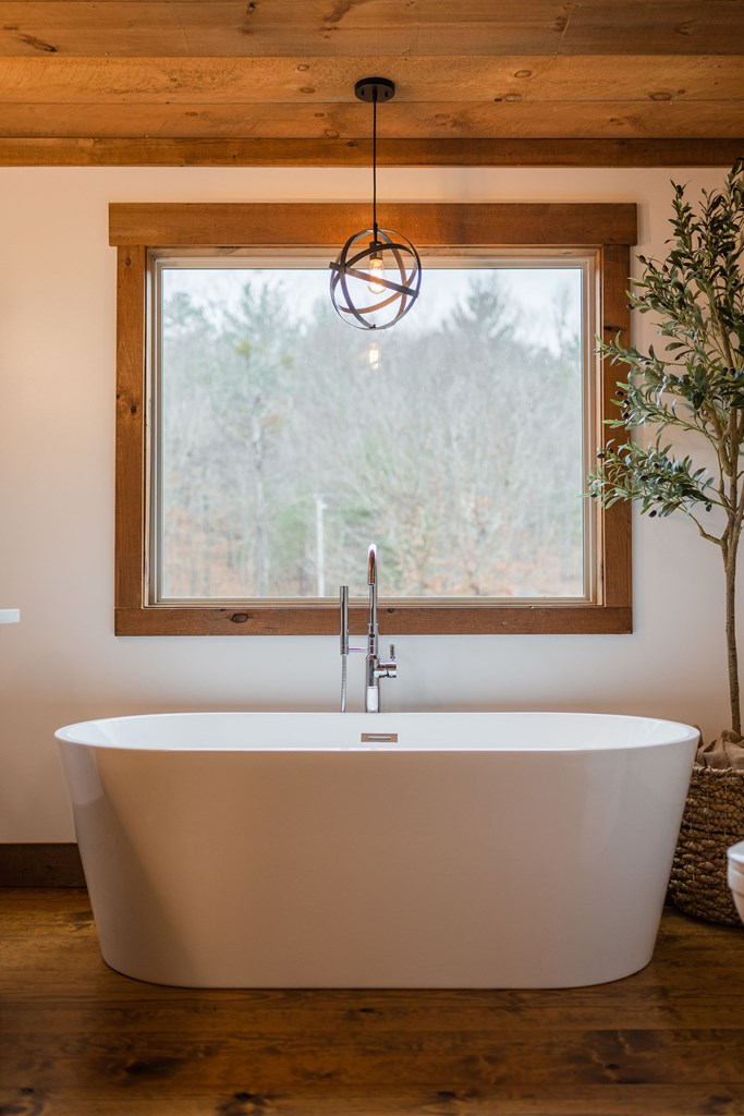 89 High Mdws Drive Morganton, GA 30560 - Photo 48 of 63 a white bath tub sitting in a bathroom
