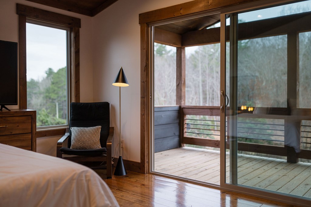 89 High Mdws Drive Morganton, GA 30560 - Photo 56 of 63 a bedroom with a bed and wooden floor