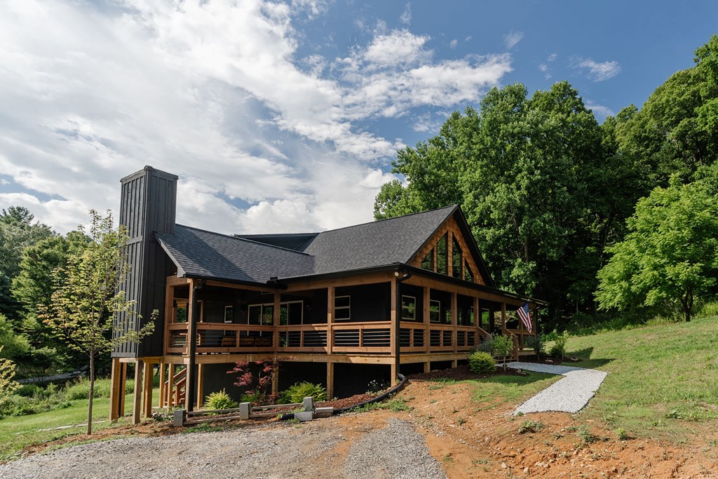 89 High Mdws Drive Morganton, GA 30560 - Photo 62 of 63 a front view of a house with a garden