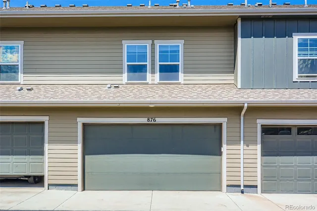 a front view of a house with a garage