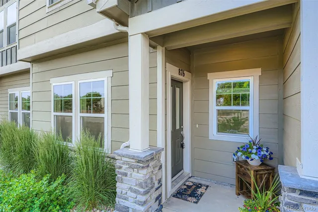 a house with beautiful flower plants