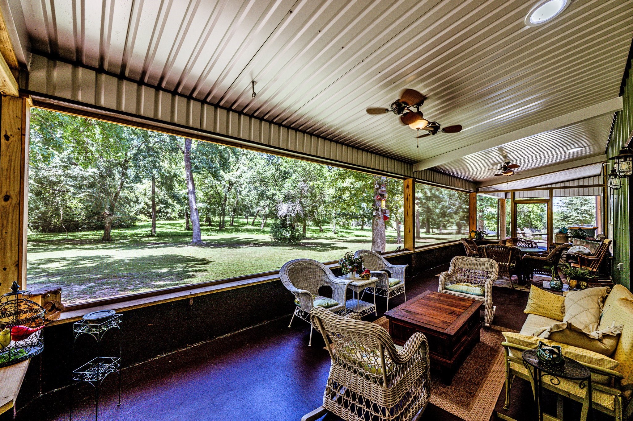 13334 Fultz Road Conroe, TX 77304 - Photo 28 of 49 Enjoy the best of outdoor living from the comfort of your screened-in porch—perfect for morning coffee, evening breezes, and peaceful views year-round.