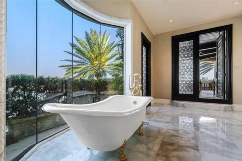 a view of a house with swimming pool and sitting area