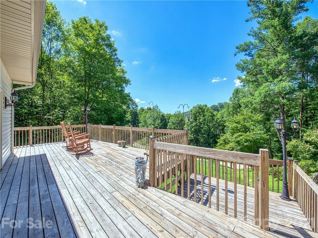 21 Rules Run Road Clyde, NC 28721 - Photo 2 of 32 a view of balcony with deck and wooden floor