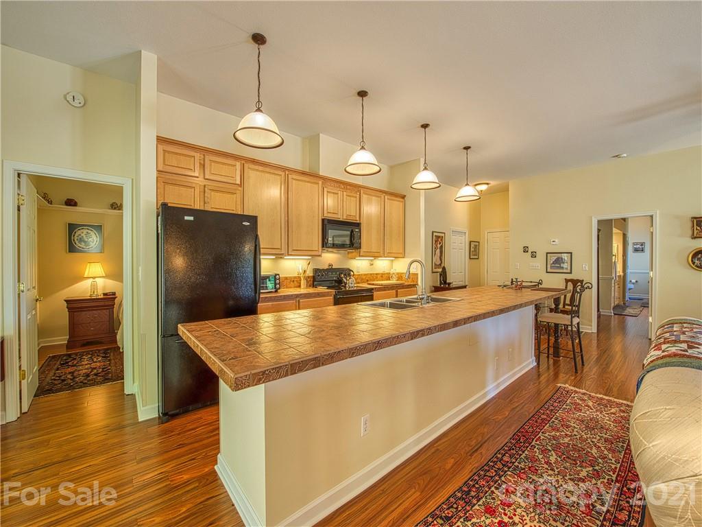 21 Rules Run Road Clyde, NC 28721 - Photo 11 of 32 a kitchen with stainless steel appliances granite countertop a sink a stove and a refrigerator