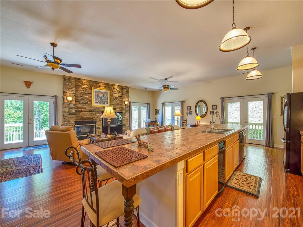 21 Rules Run Road Clyde, NC 28721 - Photo 14 of 32 a view of a dining room with furniture wooden floor and chandelier