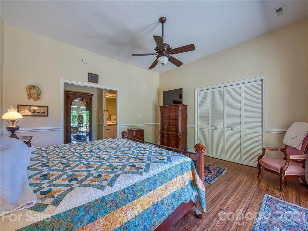 21 Rules Run Road Clyde, NC 28721 - Photo 18 of 32 a bedroom with a bed and wooden floor