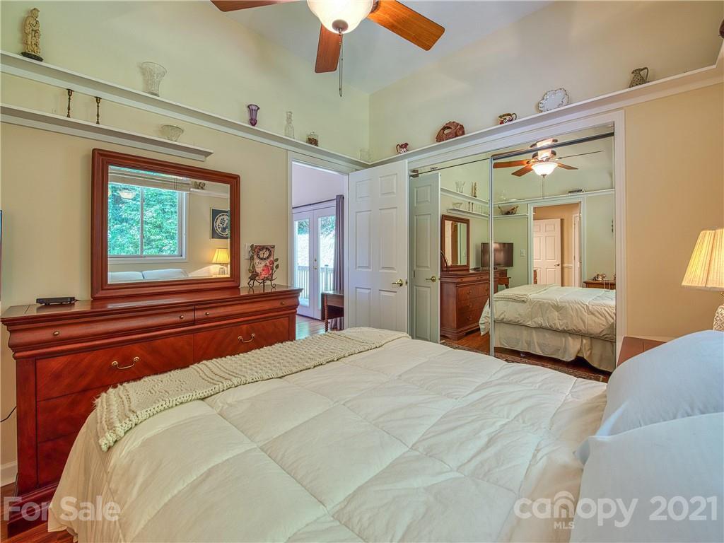 21 Rules Run Road Clyde, NC 28721 - Photo 22 of 32 a bedroom with a large bed and a large window