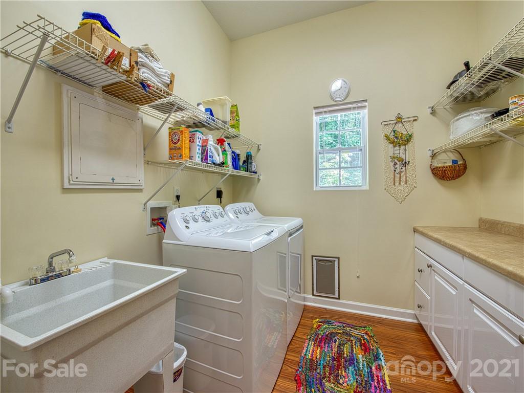 21 Rules Run Road Clyde, NC 28721 - Photo 25 of 32 a storage room with wooden floor and cabinets