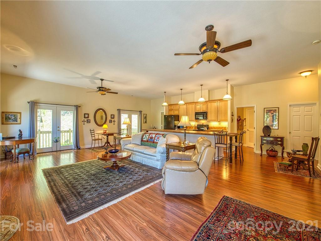 21 Rules Run Road Clyde, NC 28721 - Photo 6 of 32 a living room with fireplace furniture and a wooden floor