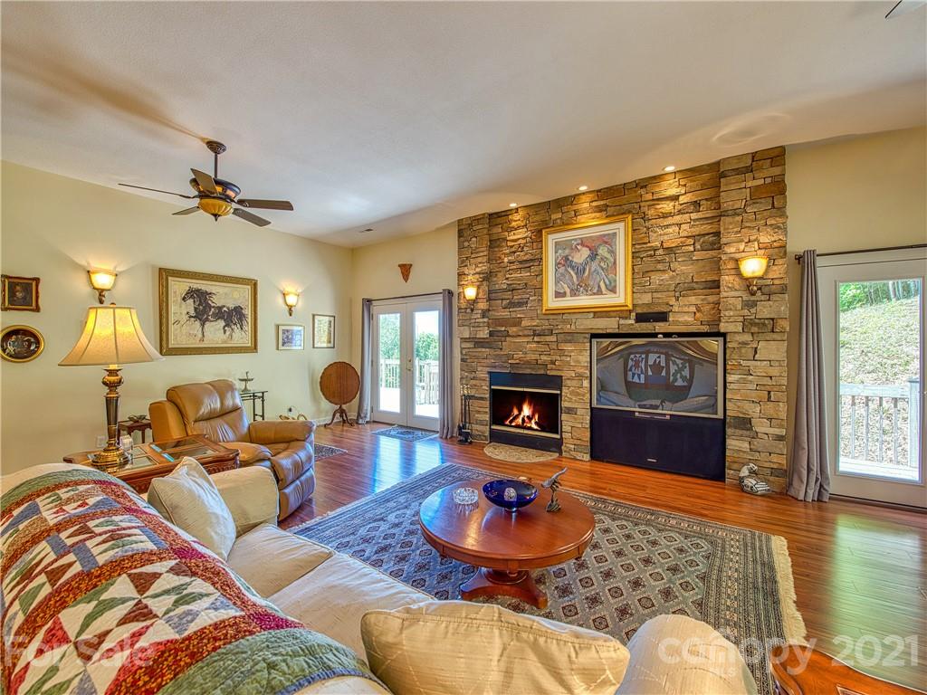 21 Rules Run Road Clyde, NC 28721 - Photo 7 of 32 a living room with furniture a fireplace and a flat screen tv